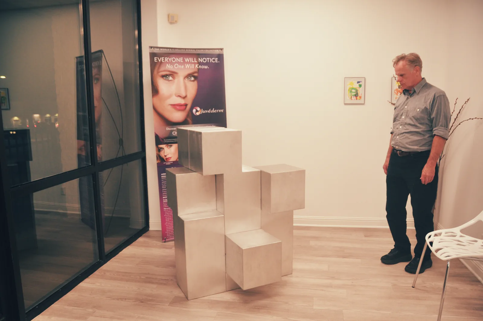 A viewer pauses near 6 Aluminum Modules.